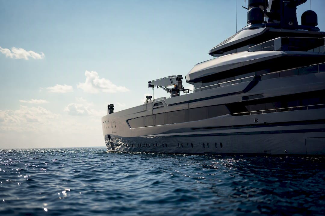 Luxury explorer yacht cruising at dawn