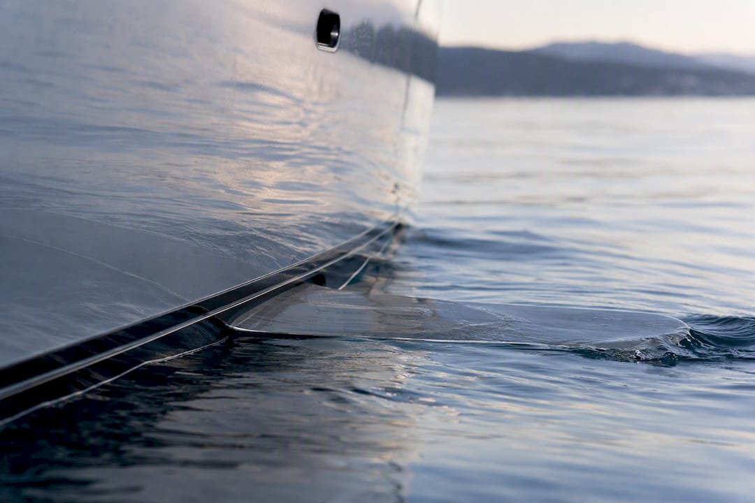 Yacht fin moving underwater during sea trial