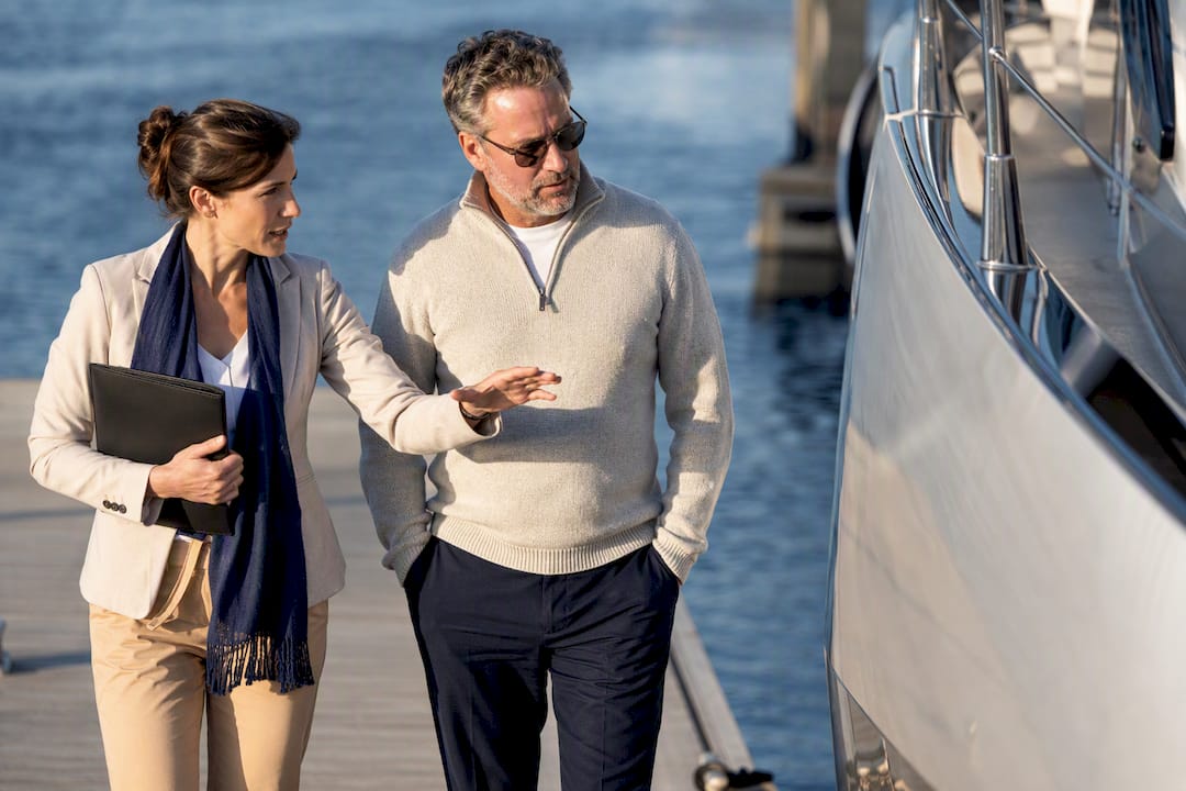 Yacht owner and broker walking dock